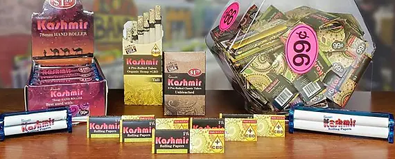 Kashmir CBD + Hemp Rolling Papers, Cigarette Tubes, and Hand Rollers are placed on a table for A Puff of Thanks, Thanksgiving party and Weed Decoration