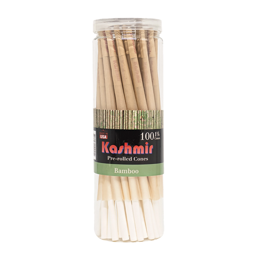 Kashmir Bamboo 1 1/4 Size Cones, 100 count jar showing natural bamboo pre-rolled cones with W-filters in a resealable clear container, made in the USA.