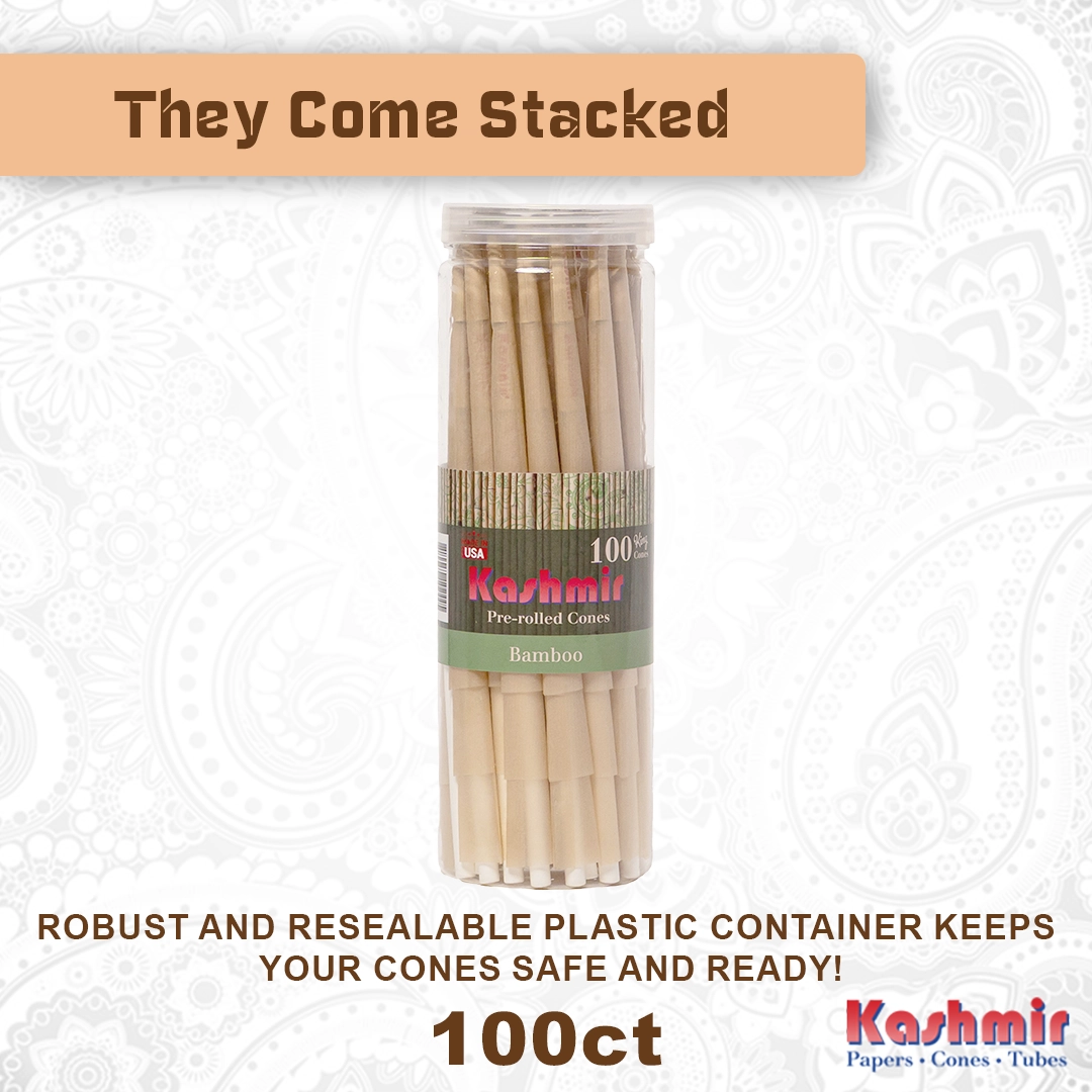 Kashmir Bamboo King Size cones, 100-count pre rolles in a jar, actual image with “They Come Stacked” banner; made with unbleached bamboo fiber rolling paper cones with built in tips in a resealable clear container, made in the USA.