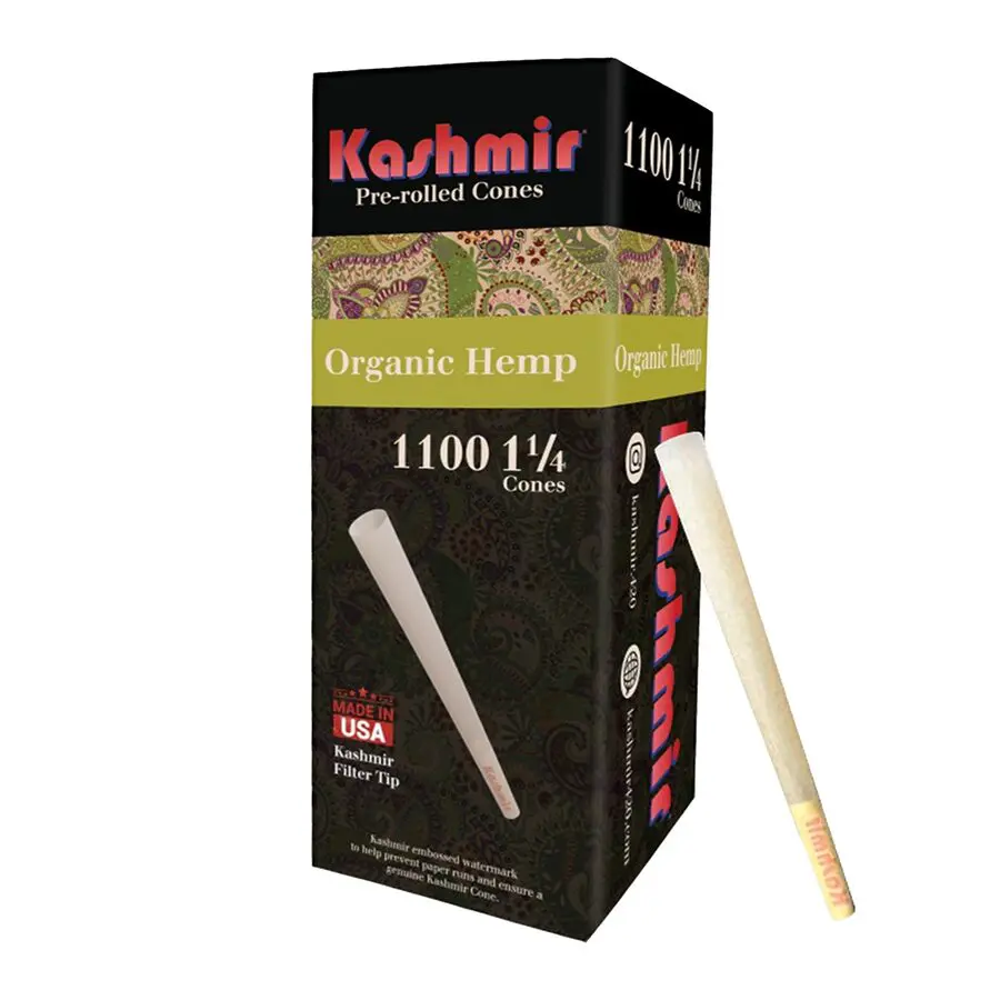 Organic hemp 1 1/4 pre-rolled cones — Kashmir 1100-count tower box with a single natural-tan unbleached hemp cone for display with Kashmir brand text on filter tip.